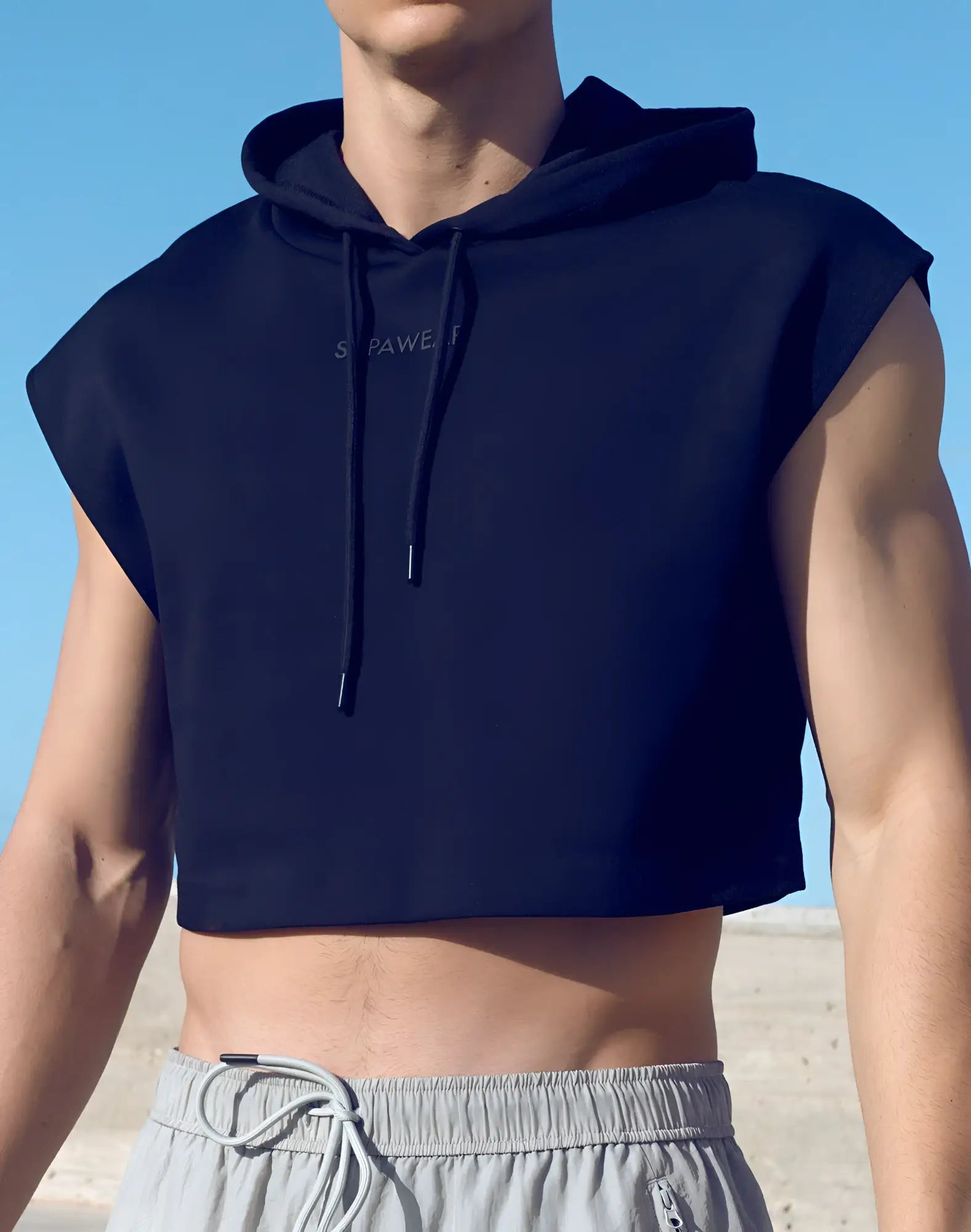 Black sleeveless cropped hoodie by Supawear with drawstrings and subtle white lettering across the chest