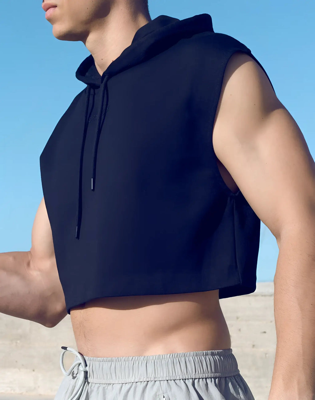 SupaWear black sleeveless cropped hoodie with drawstring hood and subtle front logo perfect for casual wear