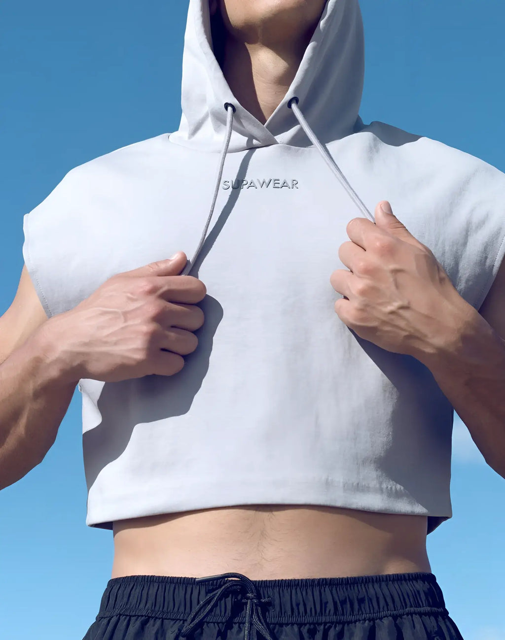 Light gray sleeveless cropped hoodie with drawstring hood and supawear embroidery across the chest
