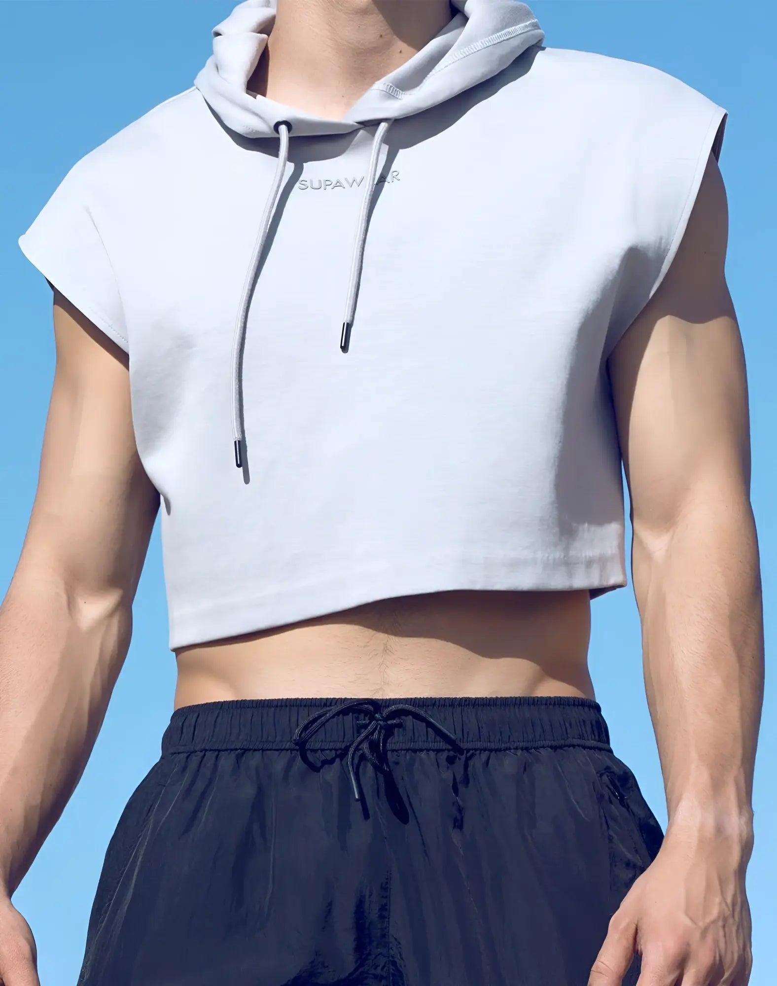 Light gray SUPAWEAR cropped sleeveless hoodie with drawstring hood and subtle supawar branding on the chest