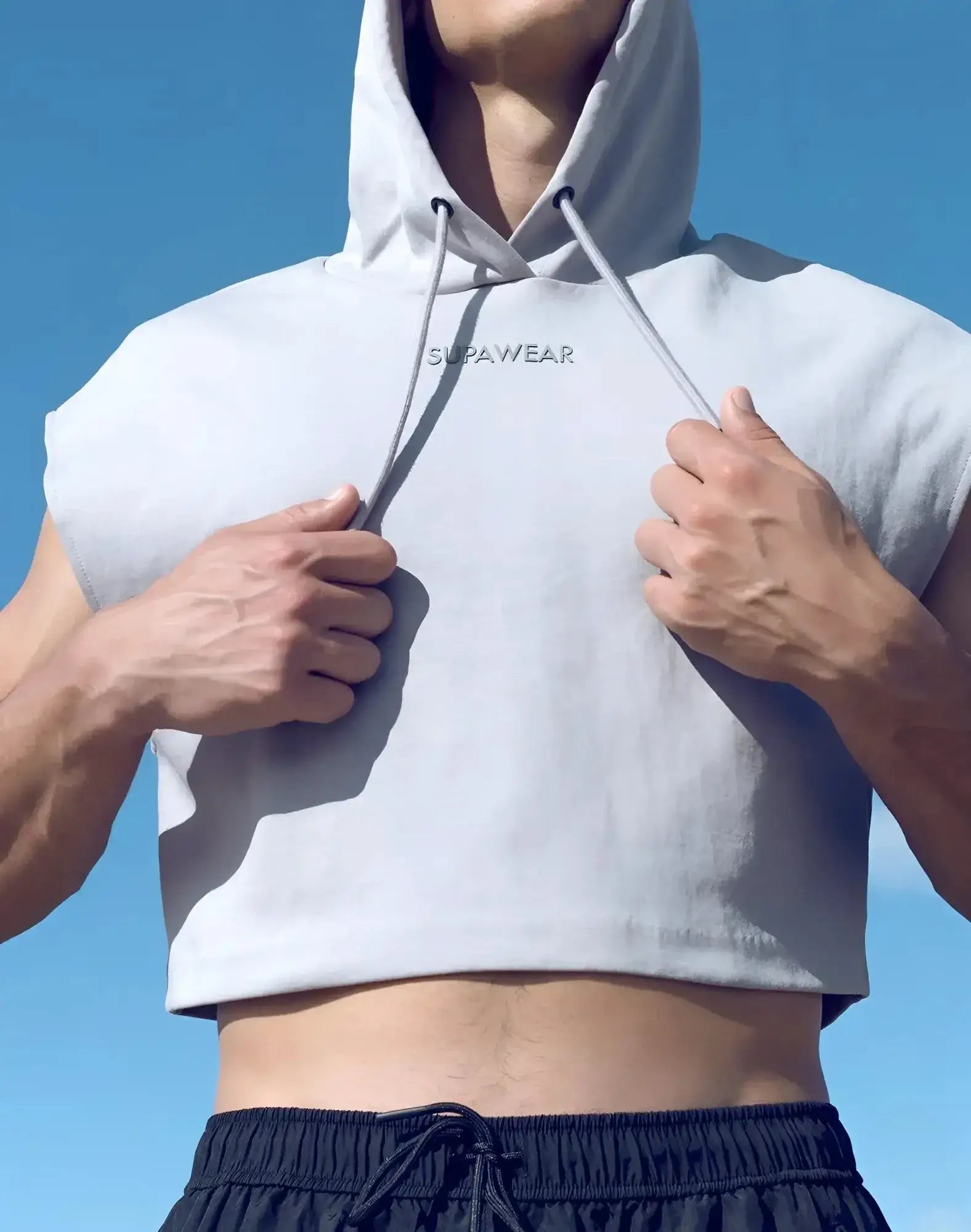 Light gray sleeveless cropped hoodie with drawstring hood and supawear embroidery across the chest