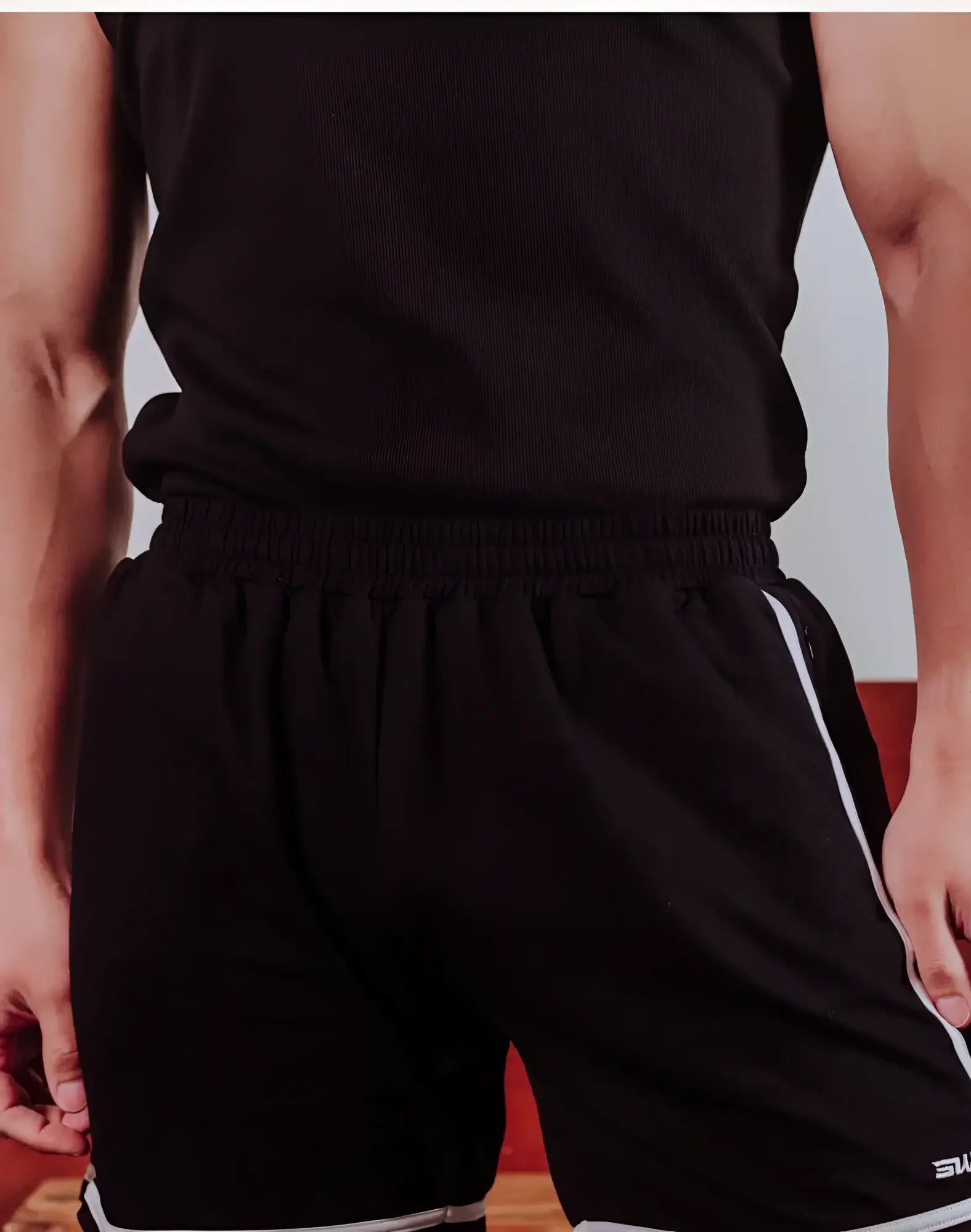 Black supawear crux shorts with white side stripes and a small logo on the lower right leg for athletic use