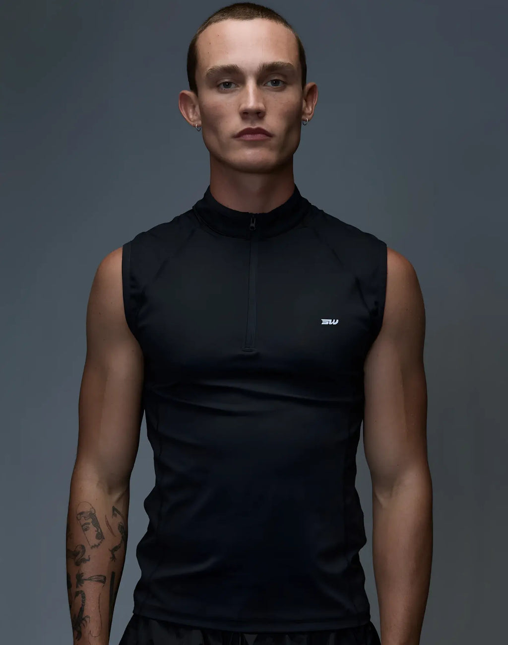 SupaWear gym2street black sleeveless athletic top with half-zip collar and subtle white logo on chest