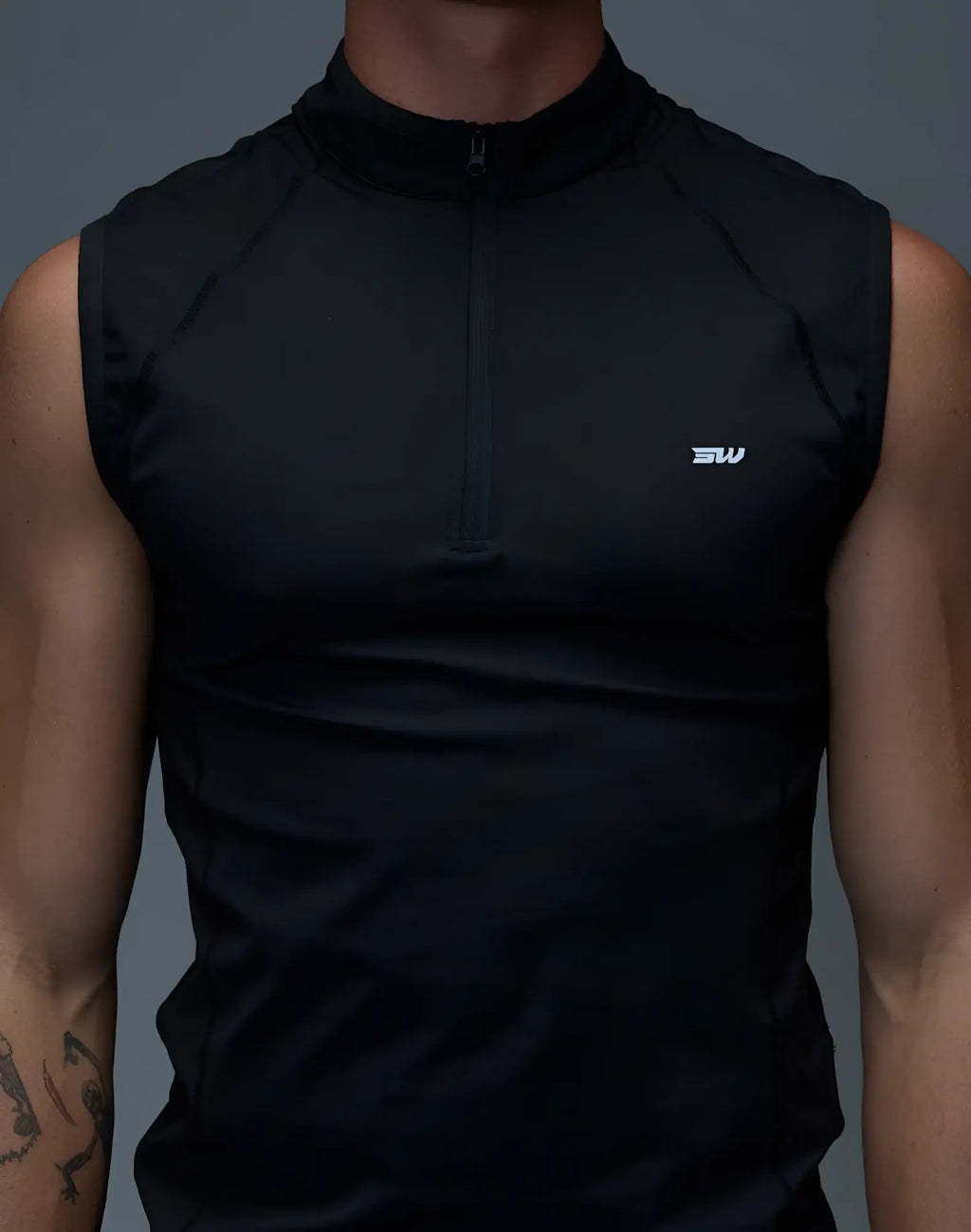 SupaWear gym2street black sleeveless athletic top with half-zip collar and subtle white logo on the chest