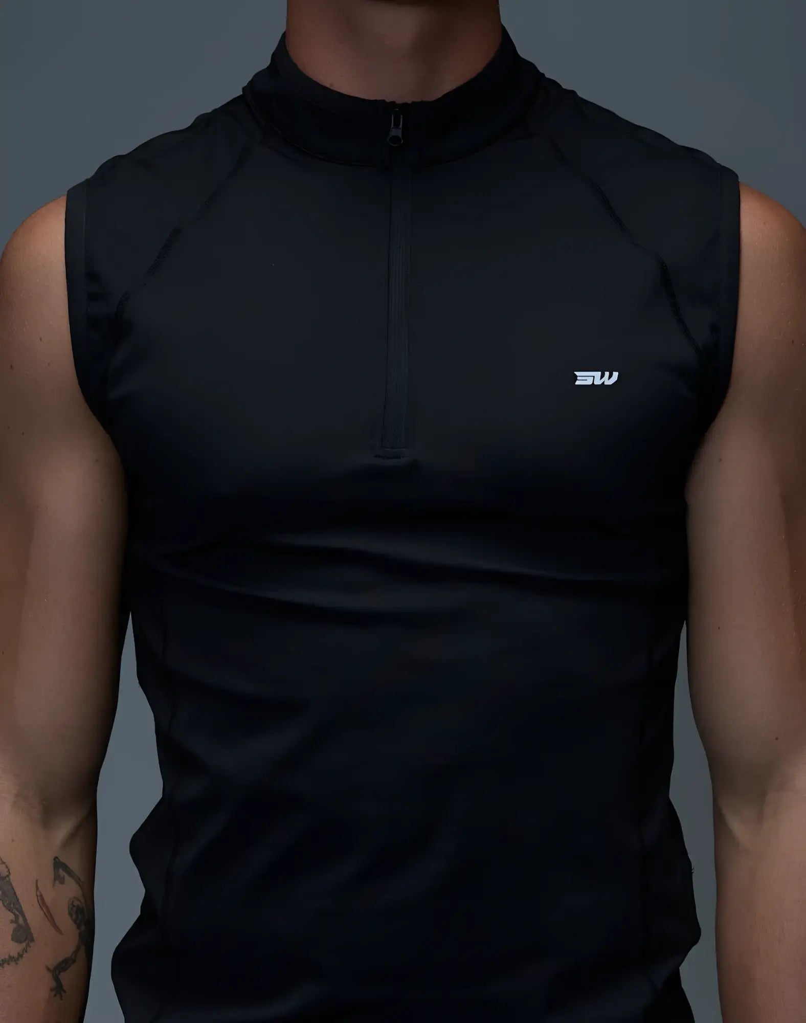 SupaWear gym2street black sleeveless athletic top with half-zip collar and subtle white logo on the chest