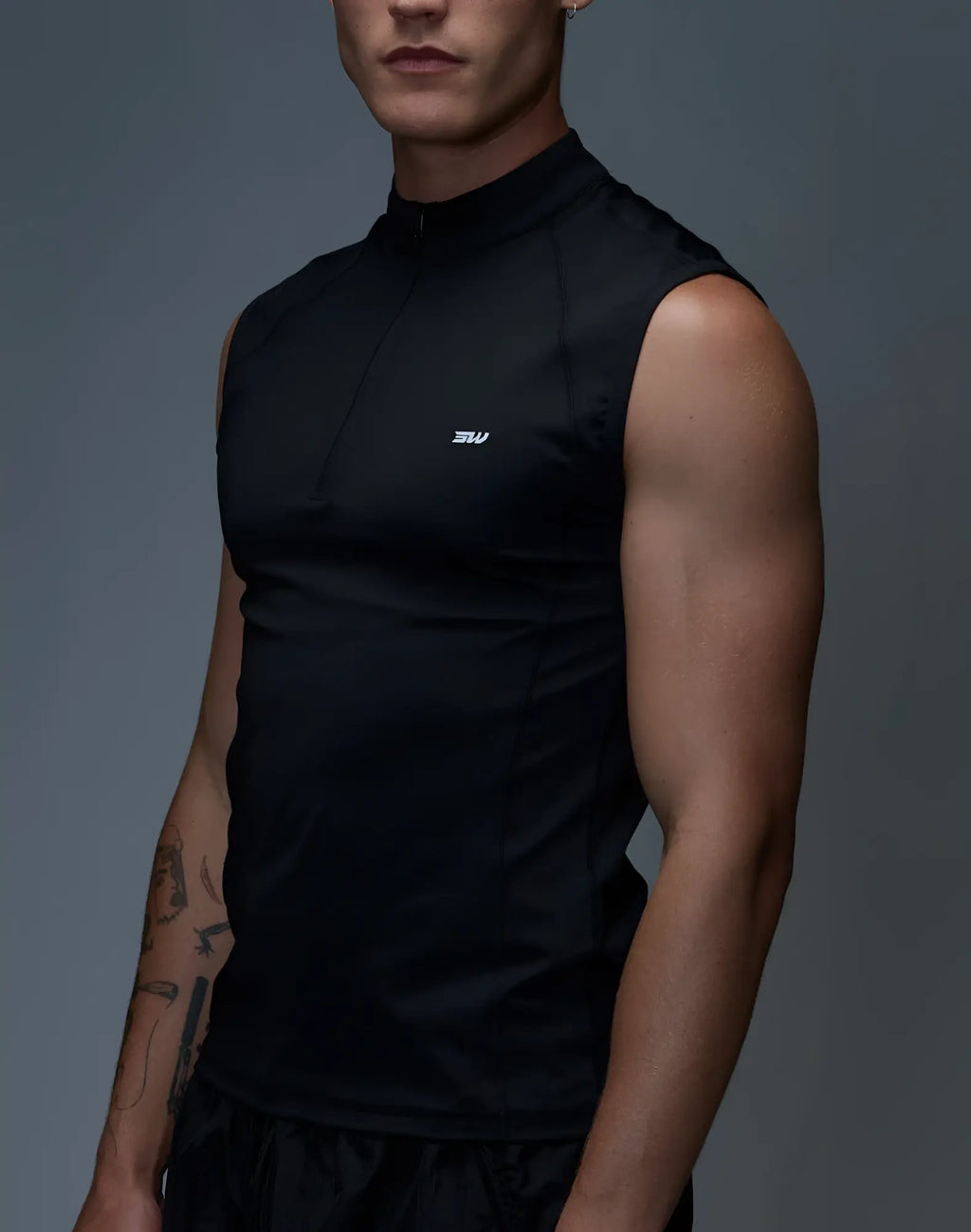 SupaWear Gym2Street black sleeveless half-zip vest with high collar and small white logo on the chest