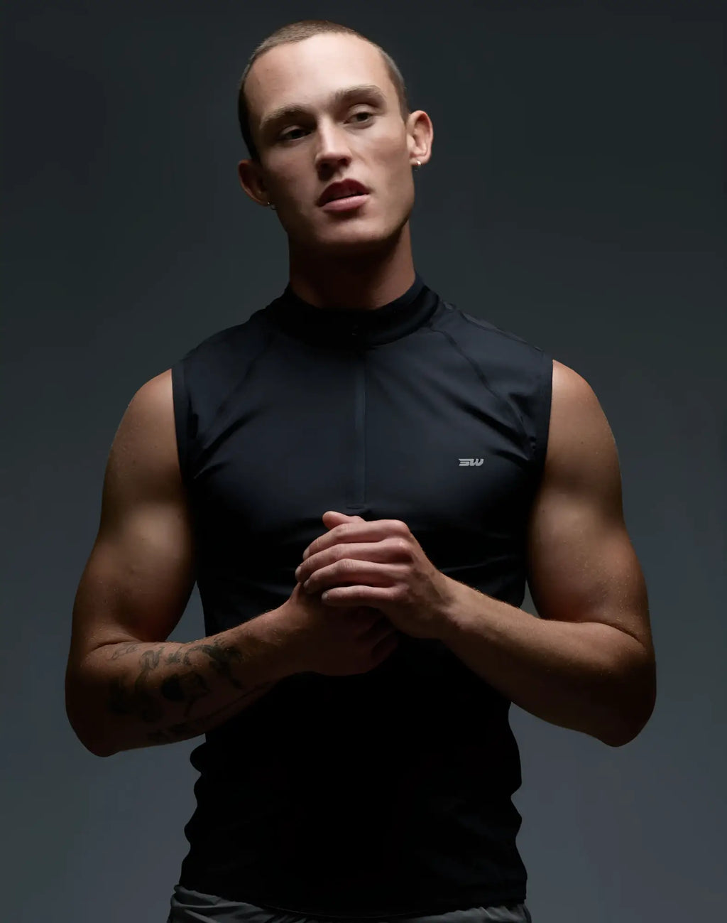 SupaWear Gym2Street black sleeveless athletic top with high collar and front half-zip for versatile workouts