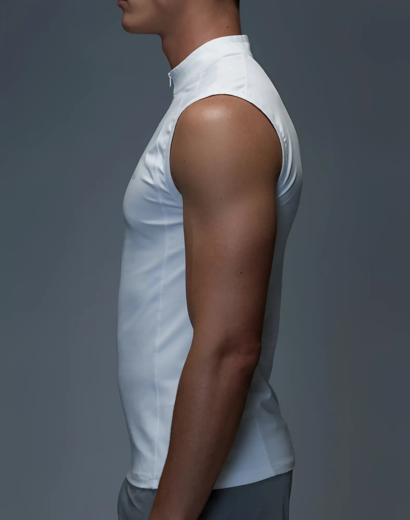 SupaWear gym2street white sleeveless athletic top with high collar and half-zip detail for versatile workouts