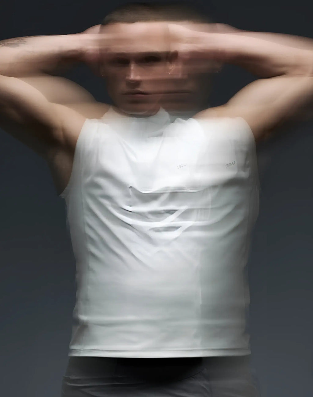 White sleeveless tank top from SUPAWEAR Gym2Street half zip vest designed for gym and street wear