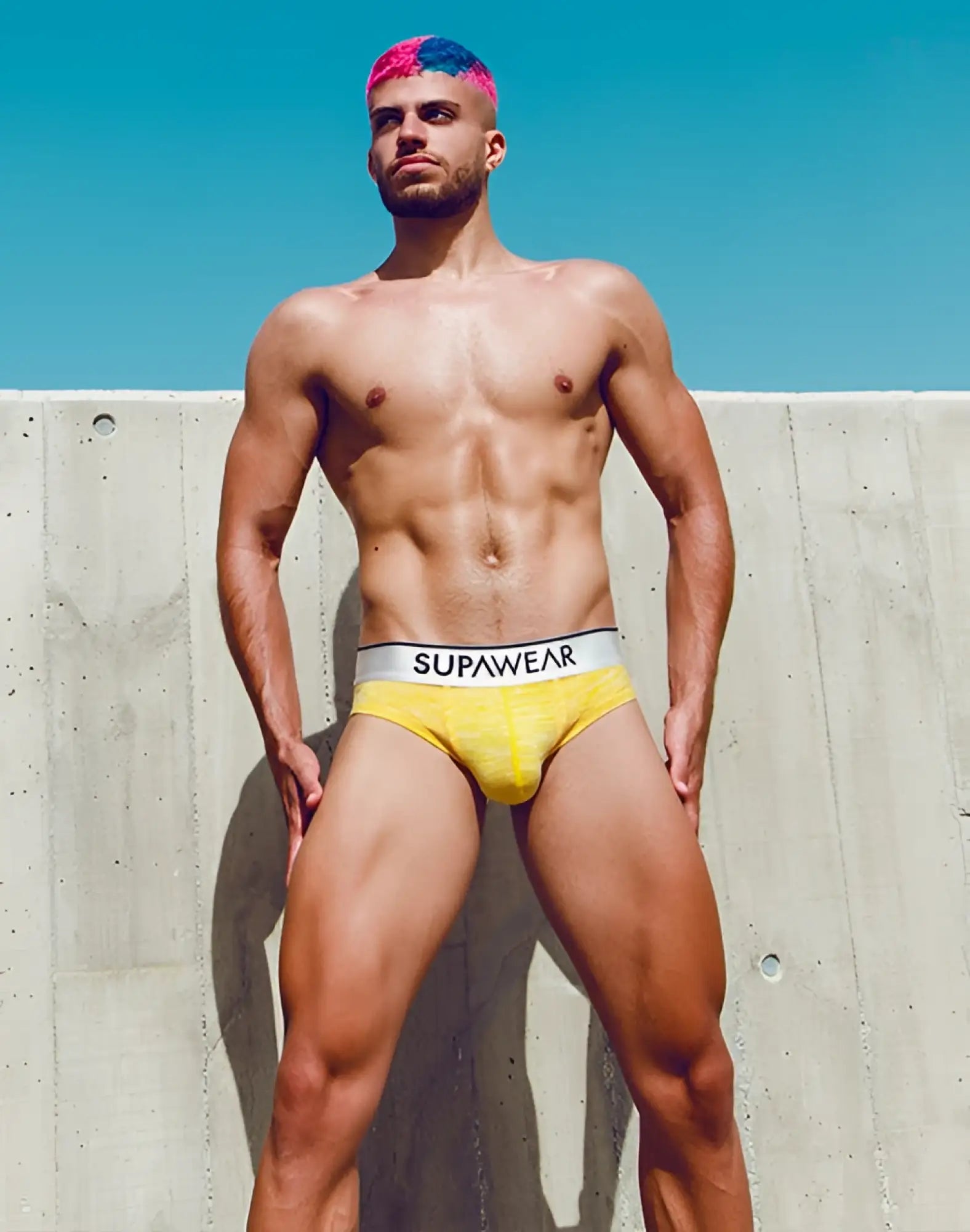 Bright yellow Supawear Hero brief underwear with white waistband and black branded lettering for comfortable wear