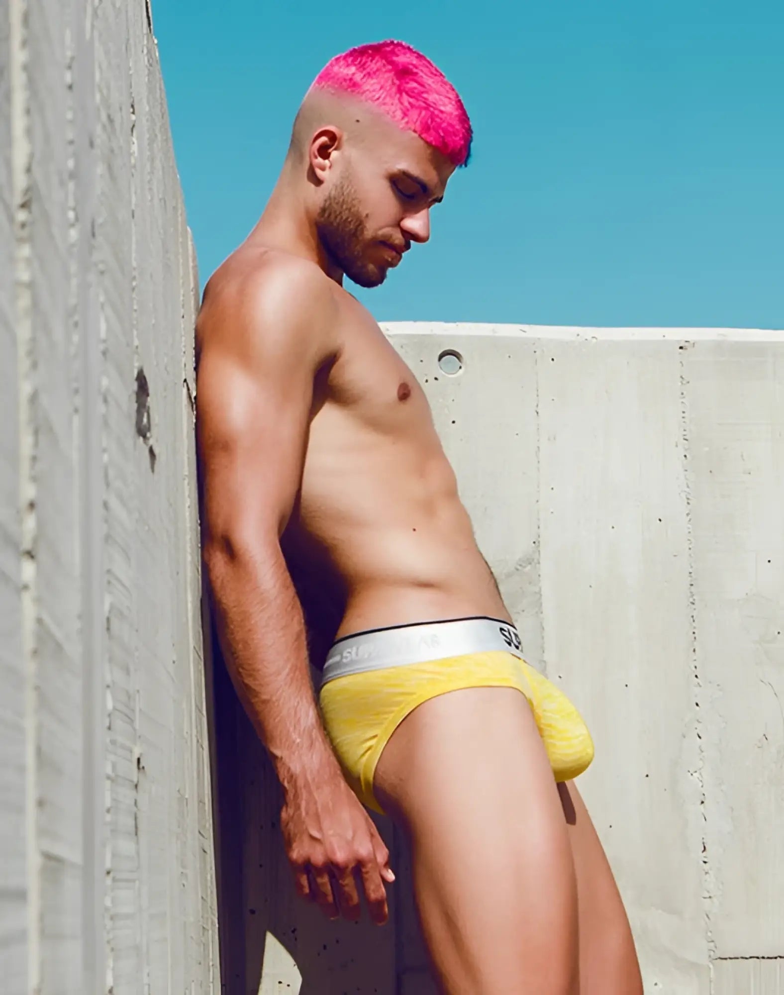 Yellow supawear hero brief underwear with silver waistband featuring the brand logo in front view