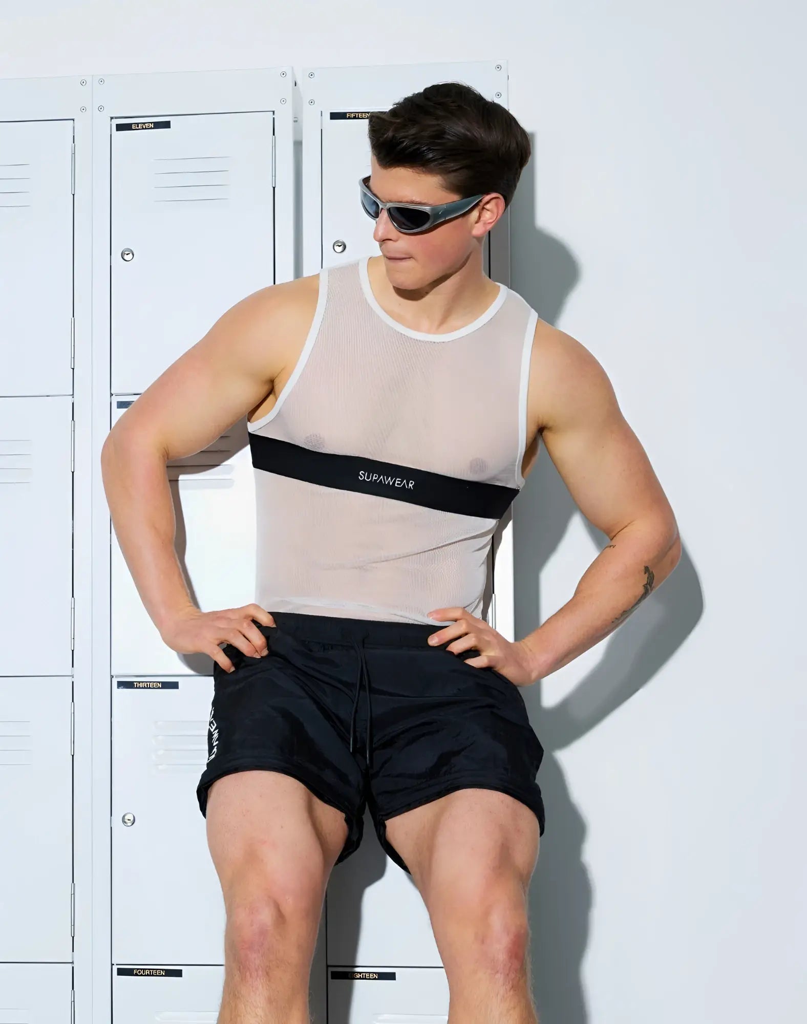 A translucent gray supawear mesh dual tone tank top with a black stripe and white logo across the chest