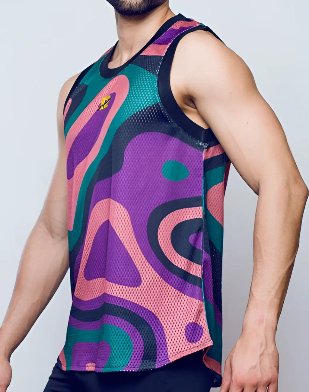 SupaWear mesh jersey tank top with vibrant purple pink teal and black abstract pattern and small yellow logo on chest