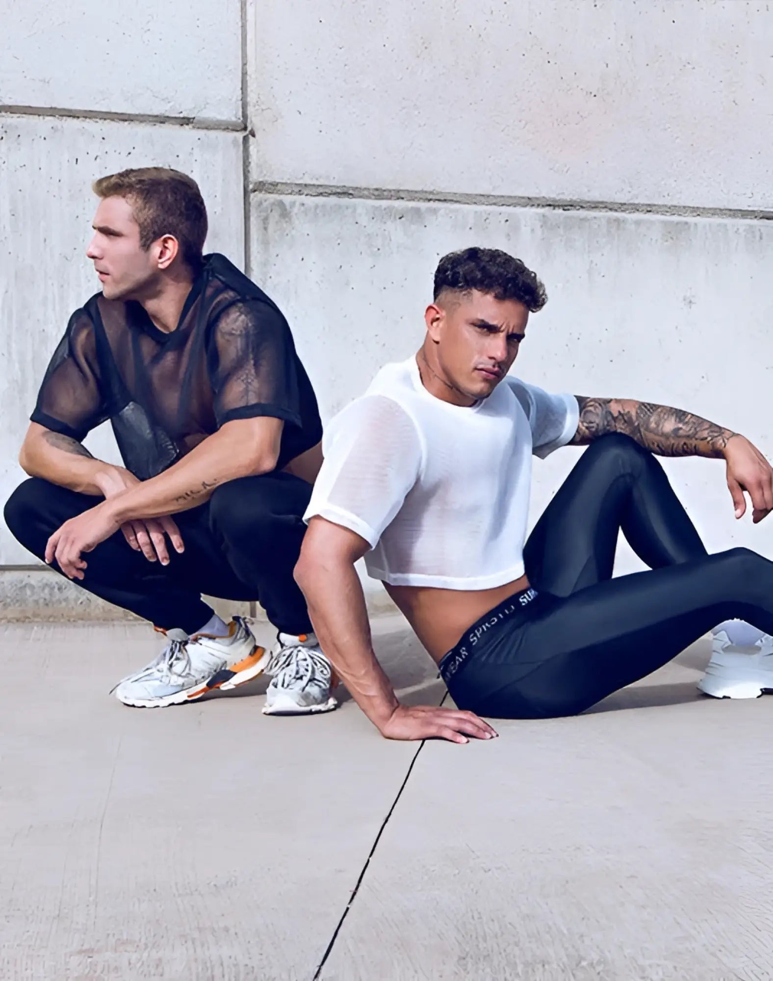 Black athletic leggings with subtle textured pattern and supawear logo on waistband paired with white mesh tee