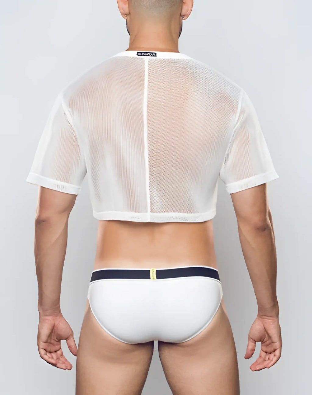 White mesh cropped tee with short sleeves and central zipper paired with white briefs with navy blue waistband by Supawear