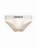 Cream-colored supawear neon briefs with a white waistband featuring black lettering in ivory color