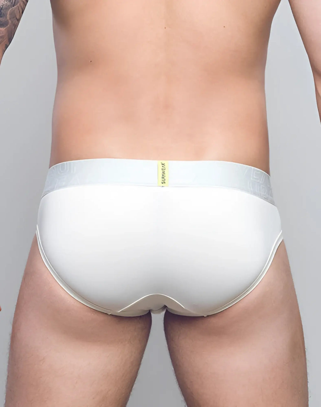 Ivory supawear neon brief underwear in white cotton with subtle textured waistband and small yellow brand tag