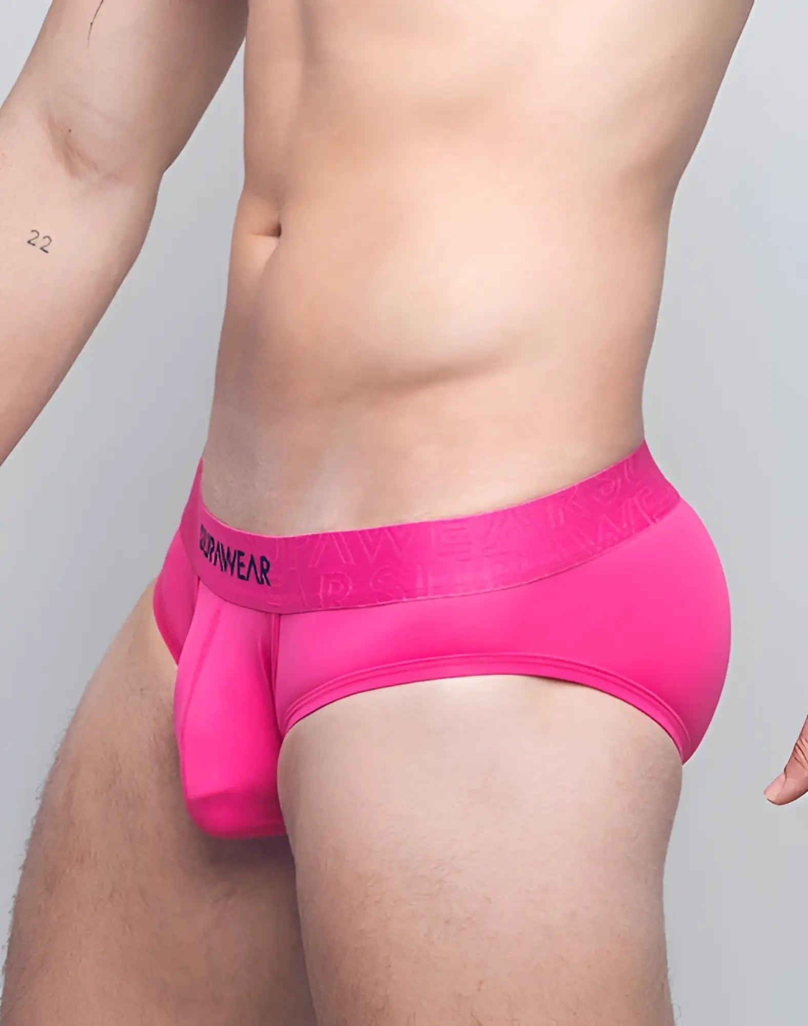 Bright pink supawear neon brief underwear with matching dornear elastic waistband in black lettering