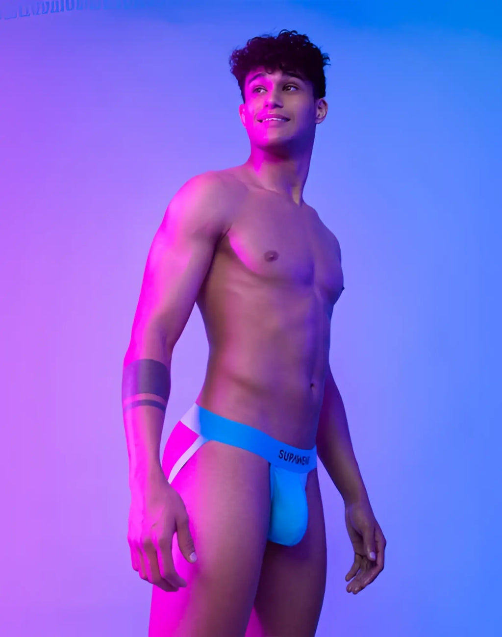 Bright blue and white neon jockstrap underwear with surmise branded waistband by SUPAWEAR in neon blue