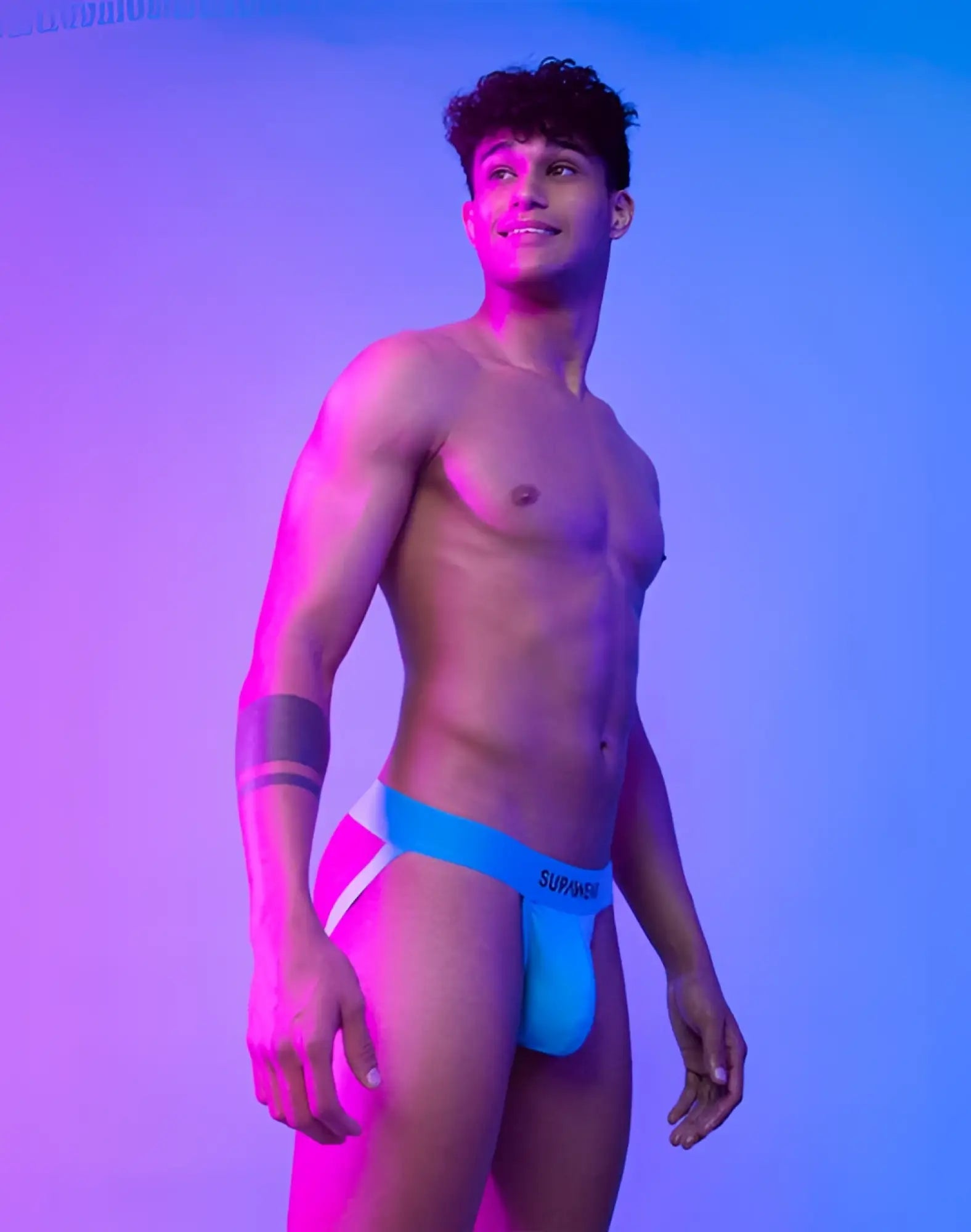 Bright blue and white neon jockstrap underwear with surmise branded waistband by SUPAWEAR in neon blue
