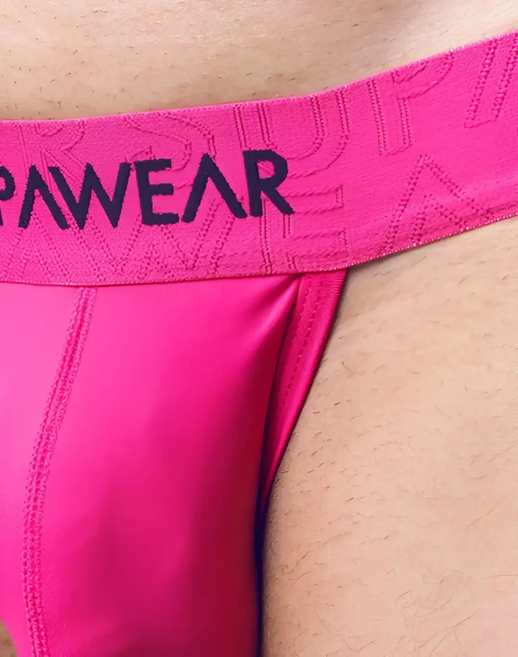 Bright pink SUPAWEAR Neon Jockstrap underwear with black pawear logo on elastic waistband for athletic use