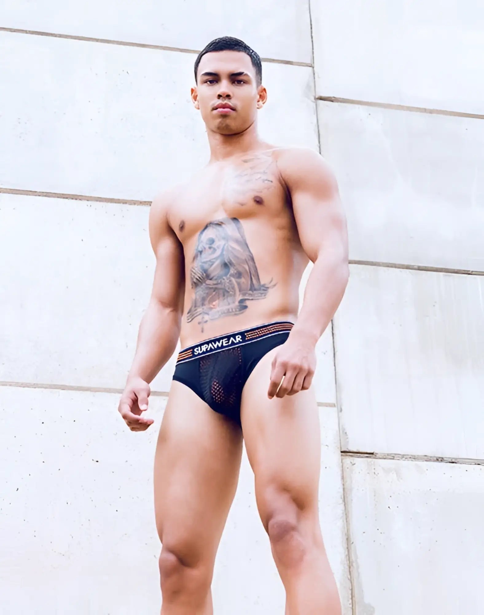 Black mesh supawear neon mesh brief underwear with red white striped waistband in neon orange accents