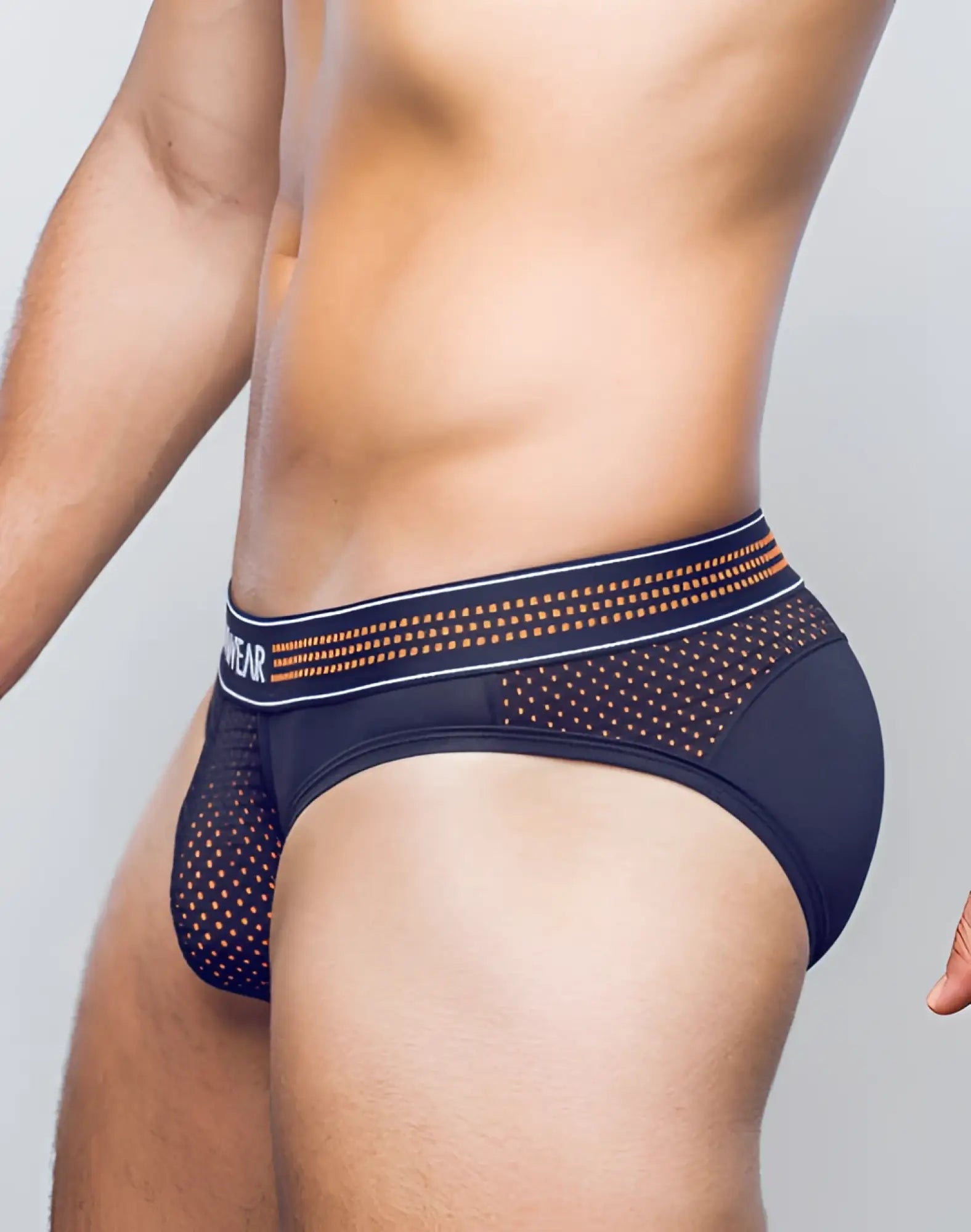 Black mesh briefs with neon orange and white patterned waistband from SUPAWEAR neon mesh brief underwear collection