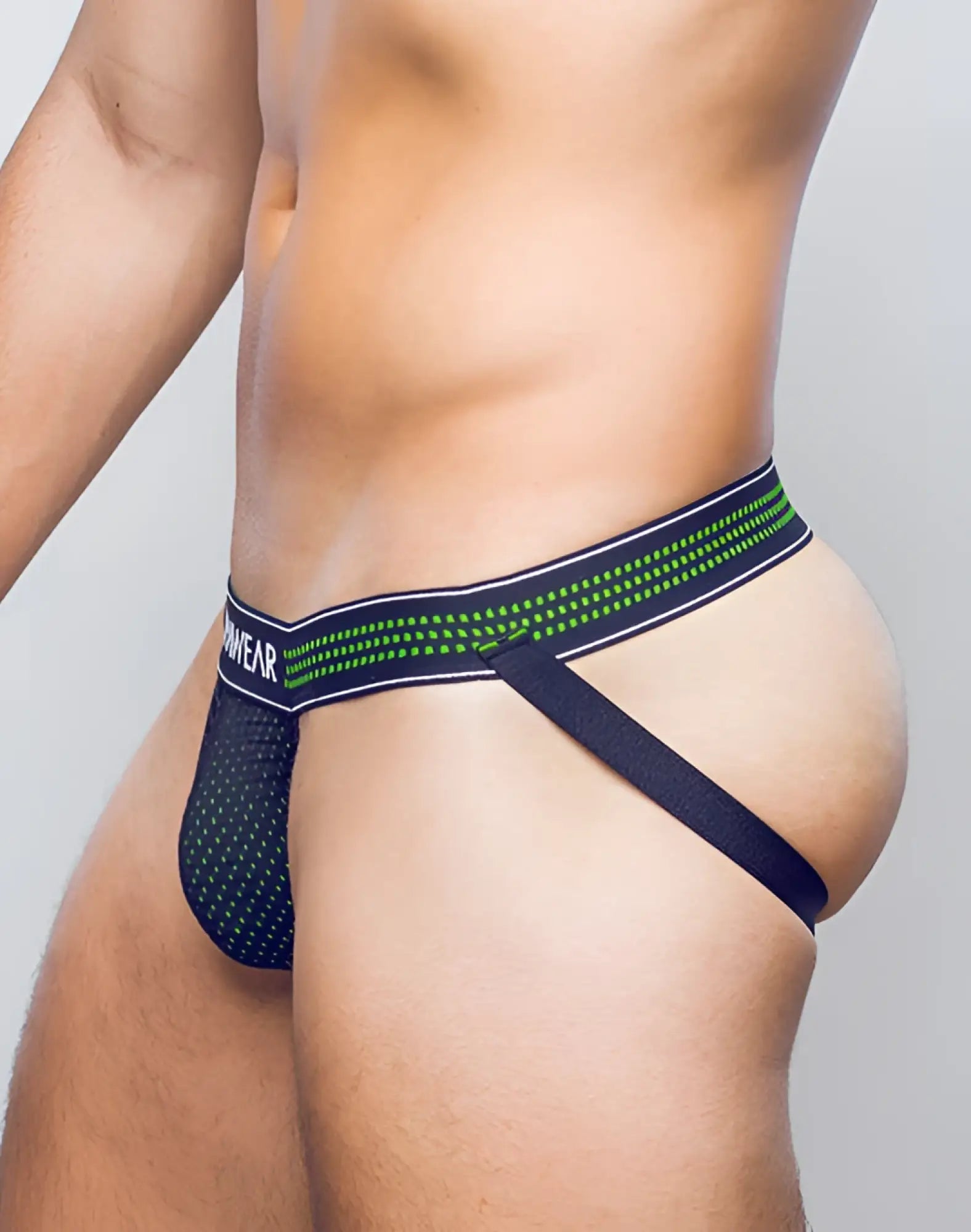 Black and neon green SUPAWEAR mesh briefs with branded waistband in a breathable neon mesh jockstrap design