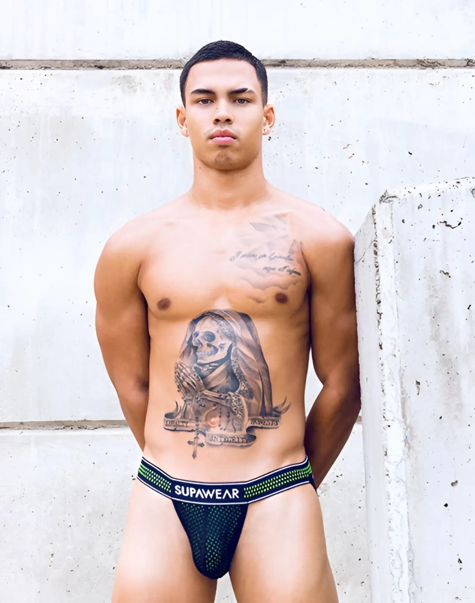 Black mesh briefs with neon green and white striped waistband featuring supawear branding from supawear neon mesh jockstrap underwear collection