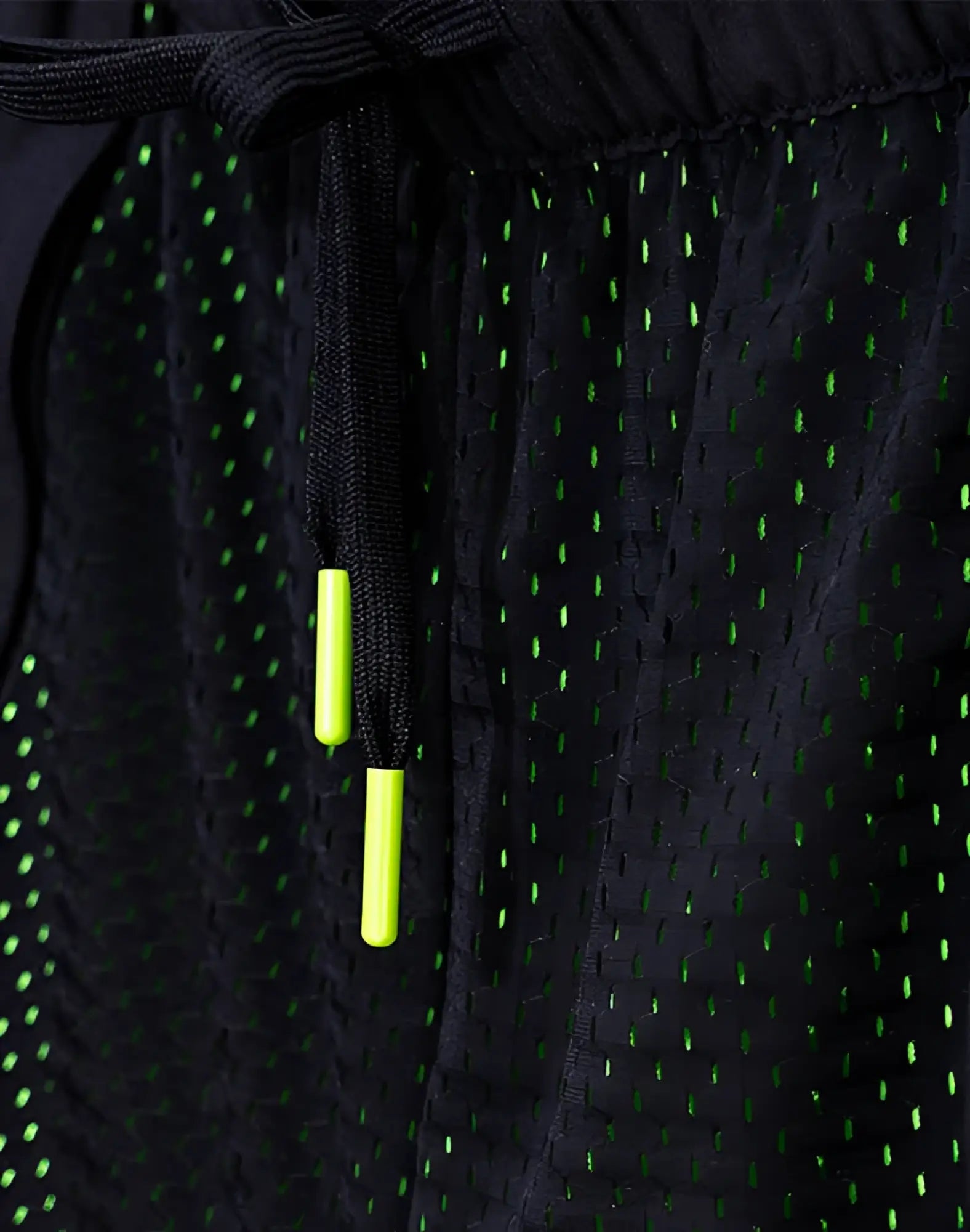 SupaWear neon mesh shorts black with neon green perforated accents and matching drawstring ties for athletic use