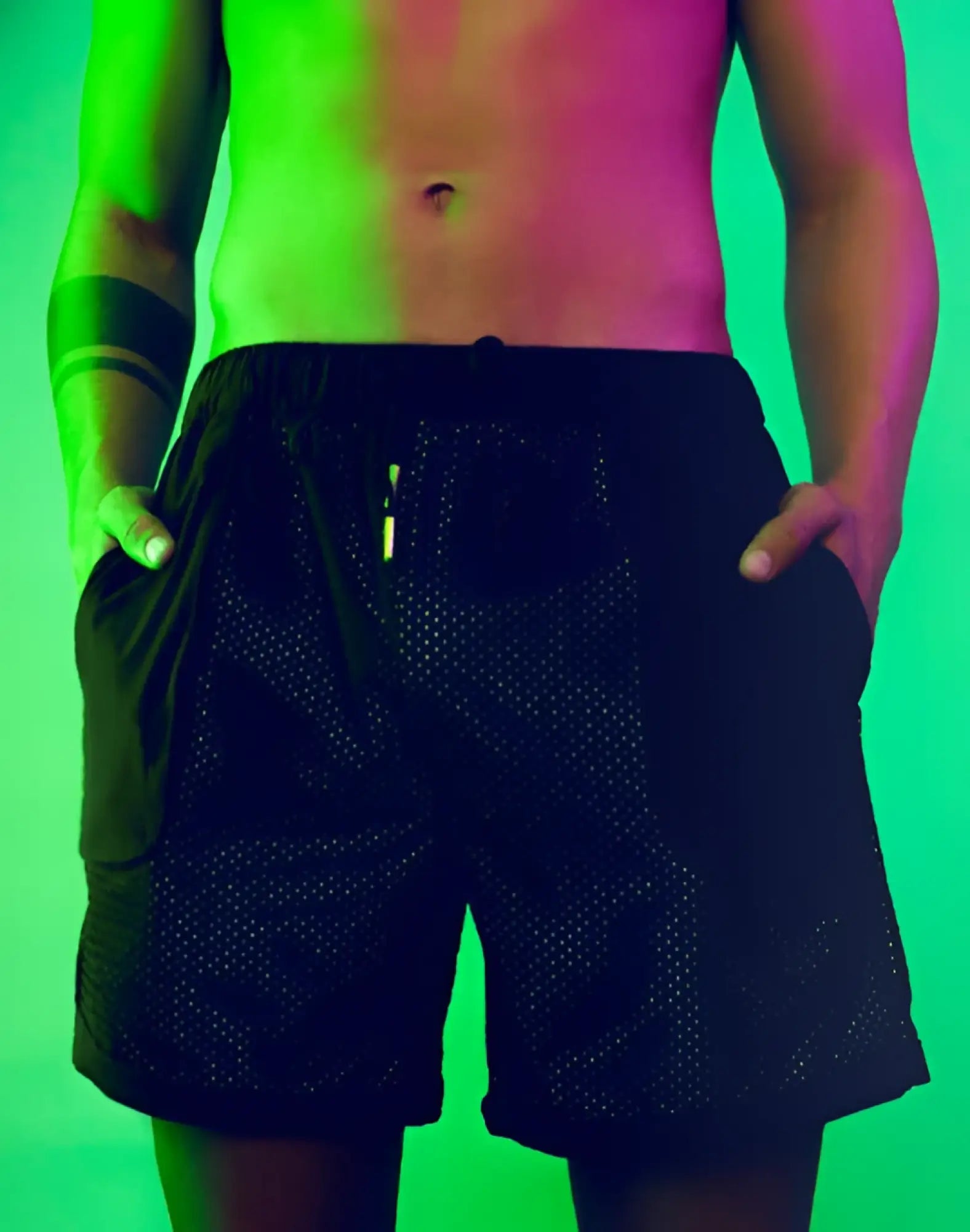 SupaWear neon mesh shorts in black featuring a drawstring waistband and side pockets for athletic use