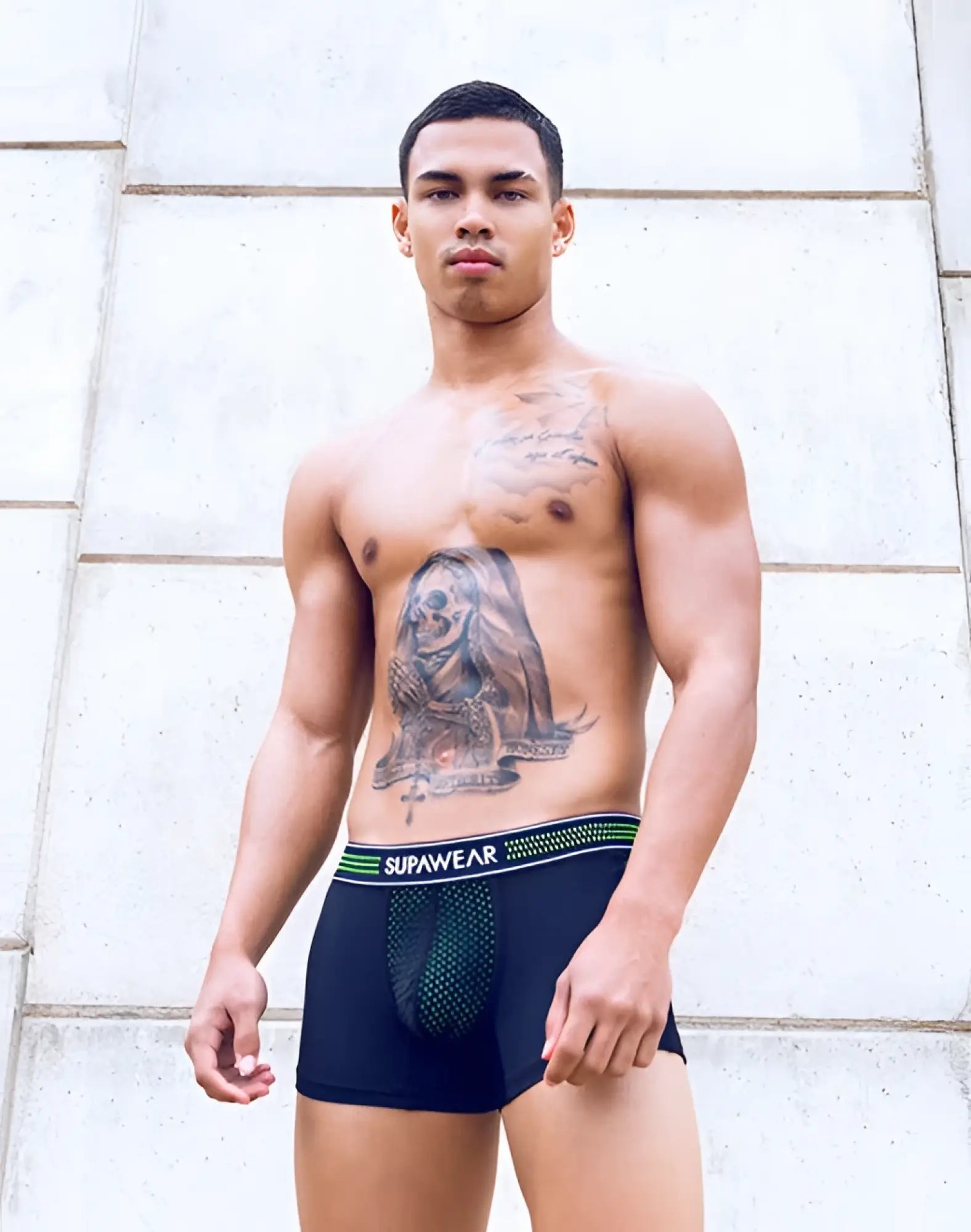 Black supawear boxer briefs with neon green and white striped waistband and front mesh panel for breathable comfort