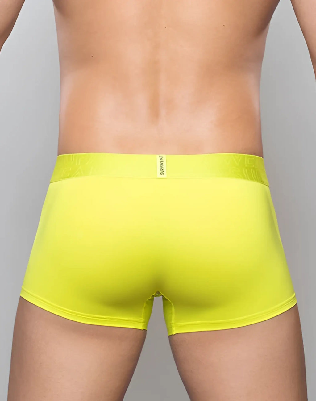 Bright yellow supawear neon trunk underwear with textured waistband and small brand tag in cyber lime color