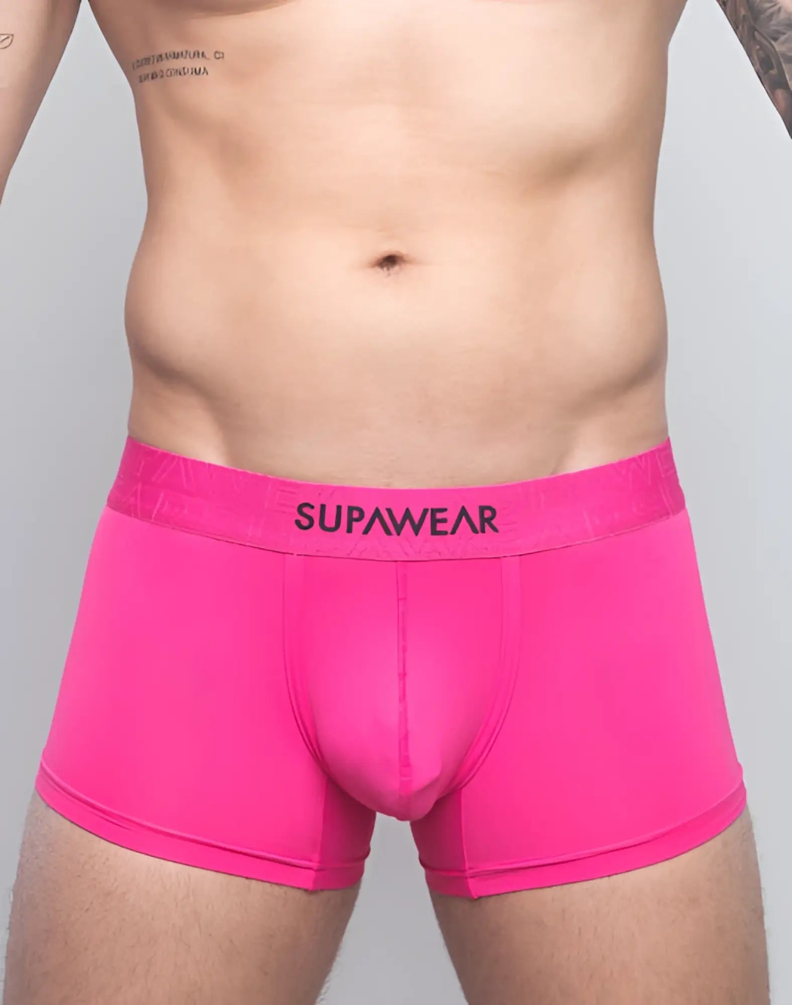 SupaWear neon pink boxer briefs with black waistband featuring brand name in a bright neon trunk style