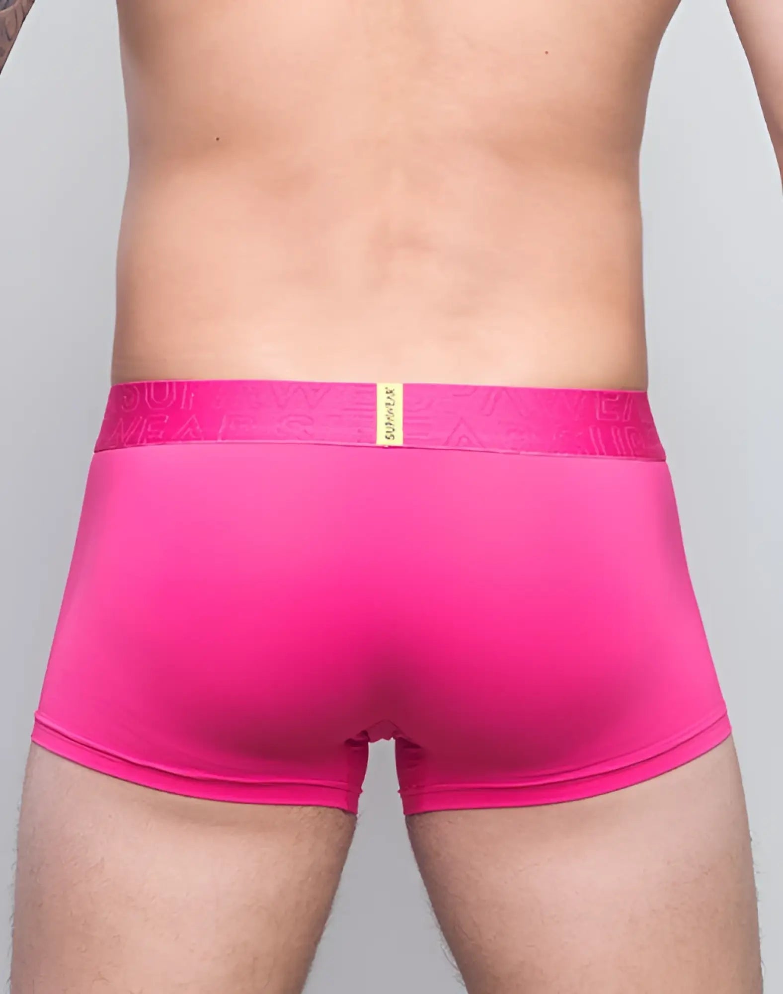Bright pink supawear neon trunk men’s boxer briefs with matching embossed branded elastic waistband