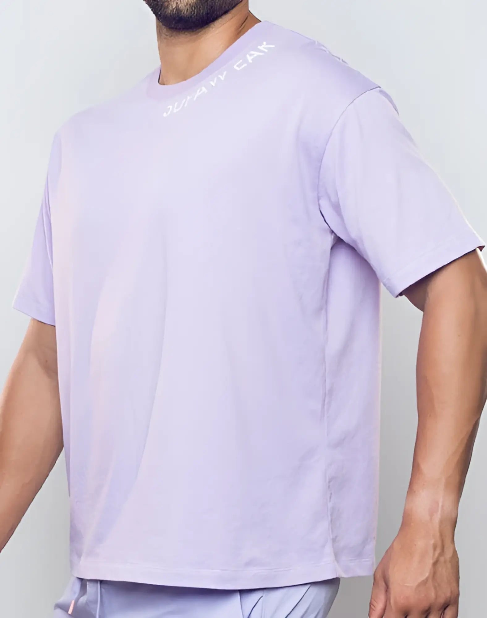 A purple heather SUPAWEAR oversized tee with short sleeves and a subtle white chest logo in lavender color