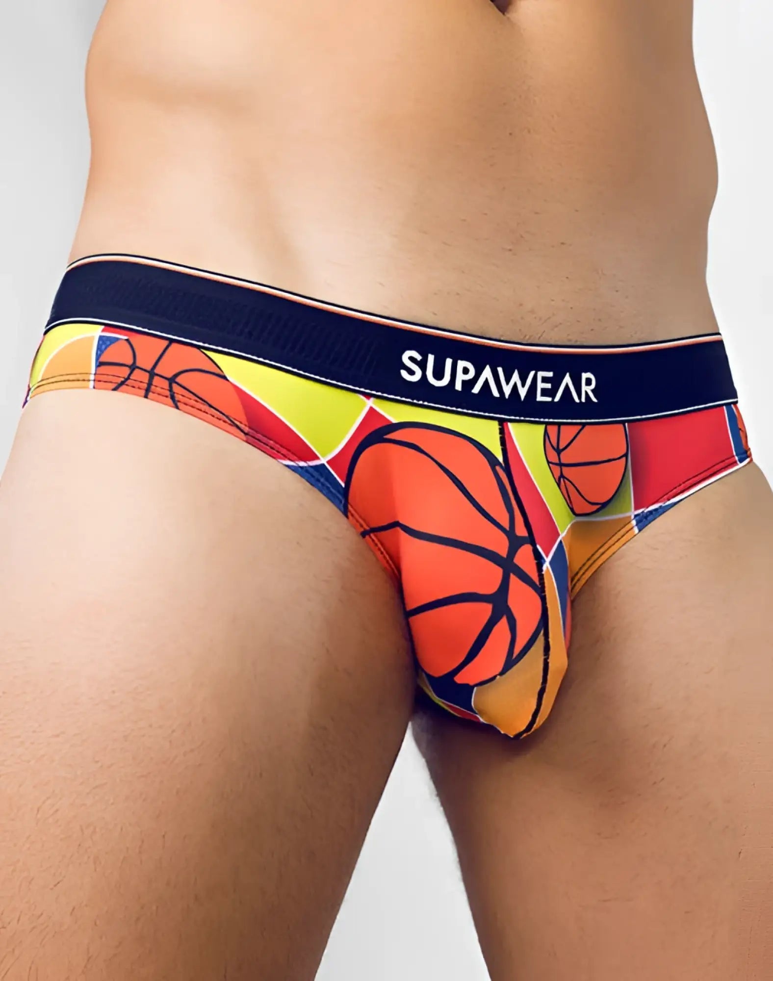 SupaWear Pow brief underwear with vibrant basketball-themed bold orange yellow and red design and navy waistband