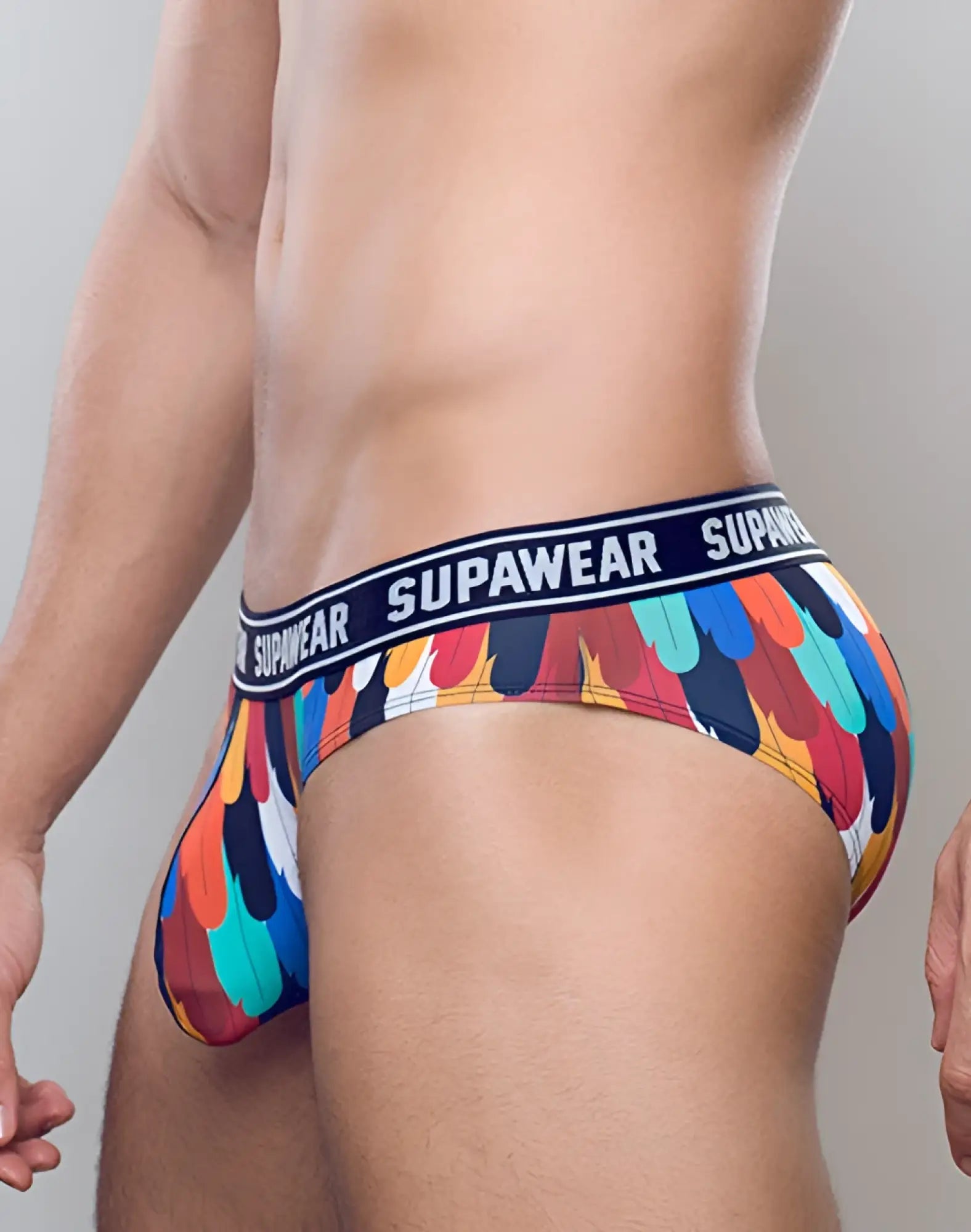 SupaWear POW brief underwear with vibrant multicolored feather pattern and navy blue waistband with SupaWear logo