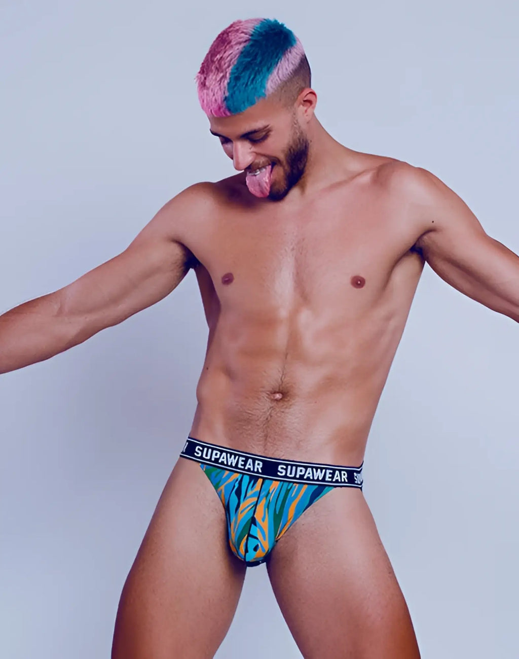 Vibrant turquoise and yellow supawear pow jockstrap briefs with black waistband featuring abstract arctic animal pattern
