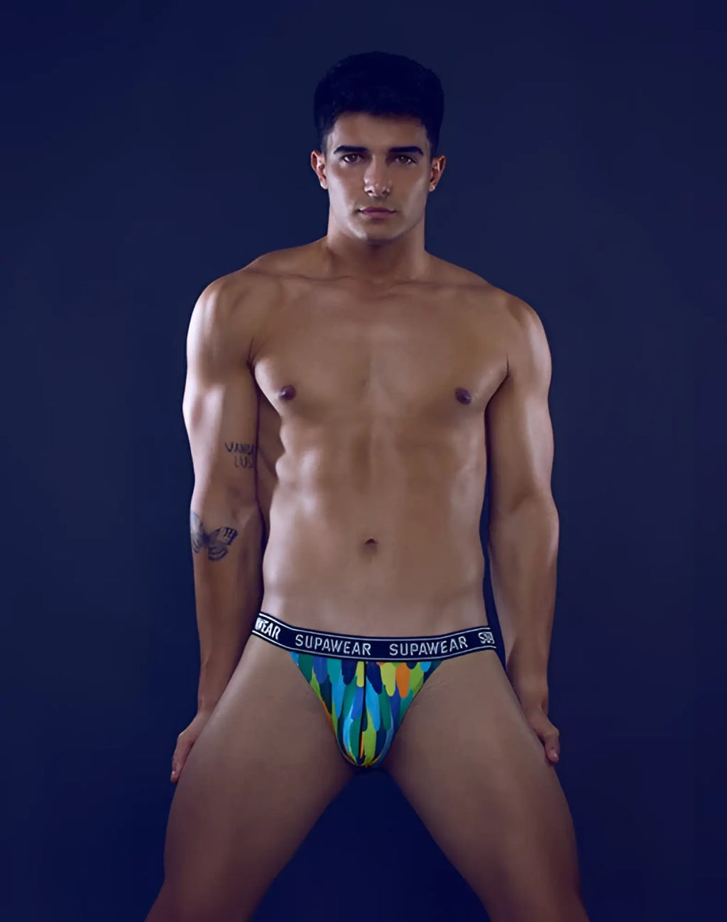 Supawea pow jockstrap underwear in vibrant multicolored flame pattern with black elastic waistband front view