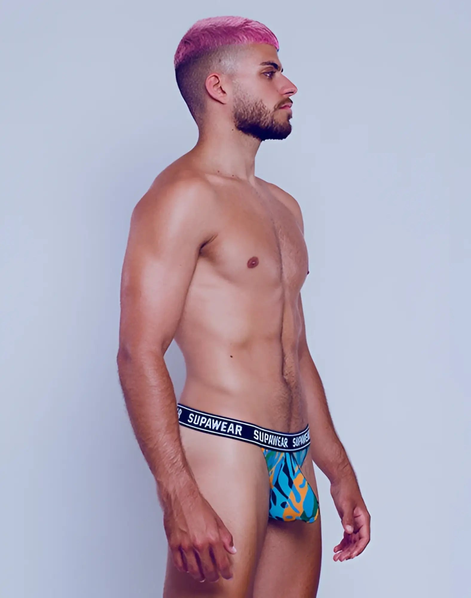 Blue and yellow flame-patterned supawear briefs with black waistband and white brand name from supawear pow thong underwear arctic animal