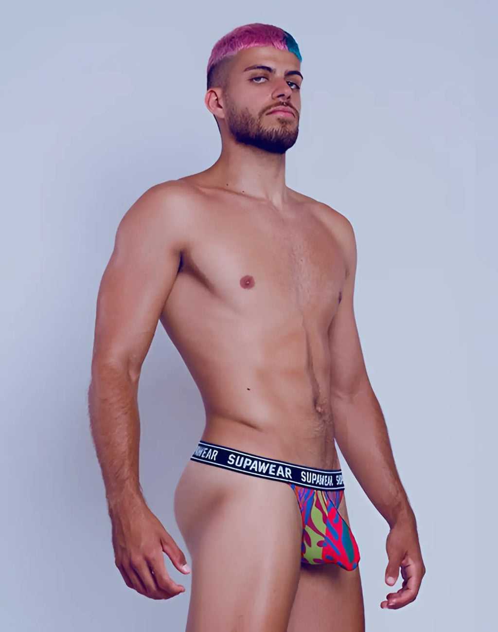 SupaWear POW thong underwear in crimson beast with vibrant multicolored geometric pattern and black elastic waistband