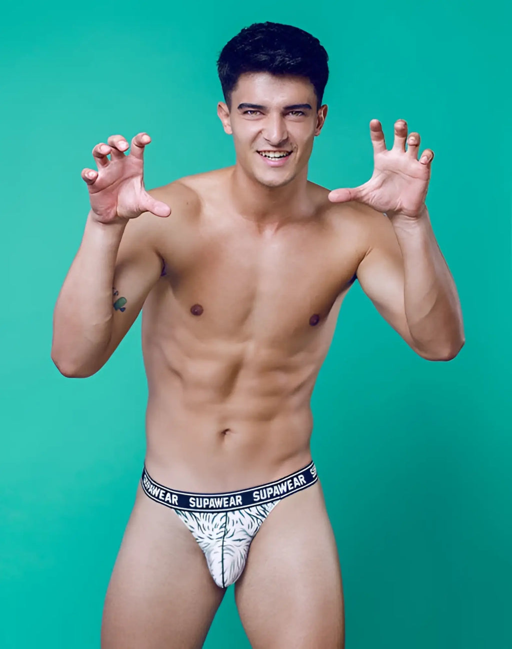 Supawea pow thong underwear in white and black with tropical leaf pattern designed for comfortable everyday wear