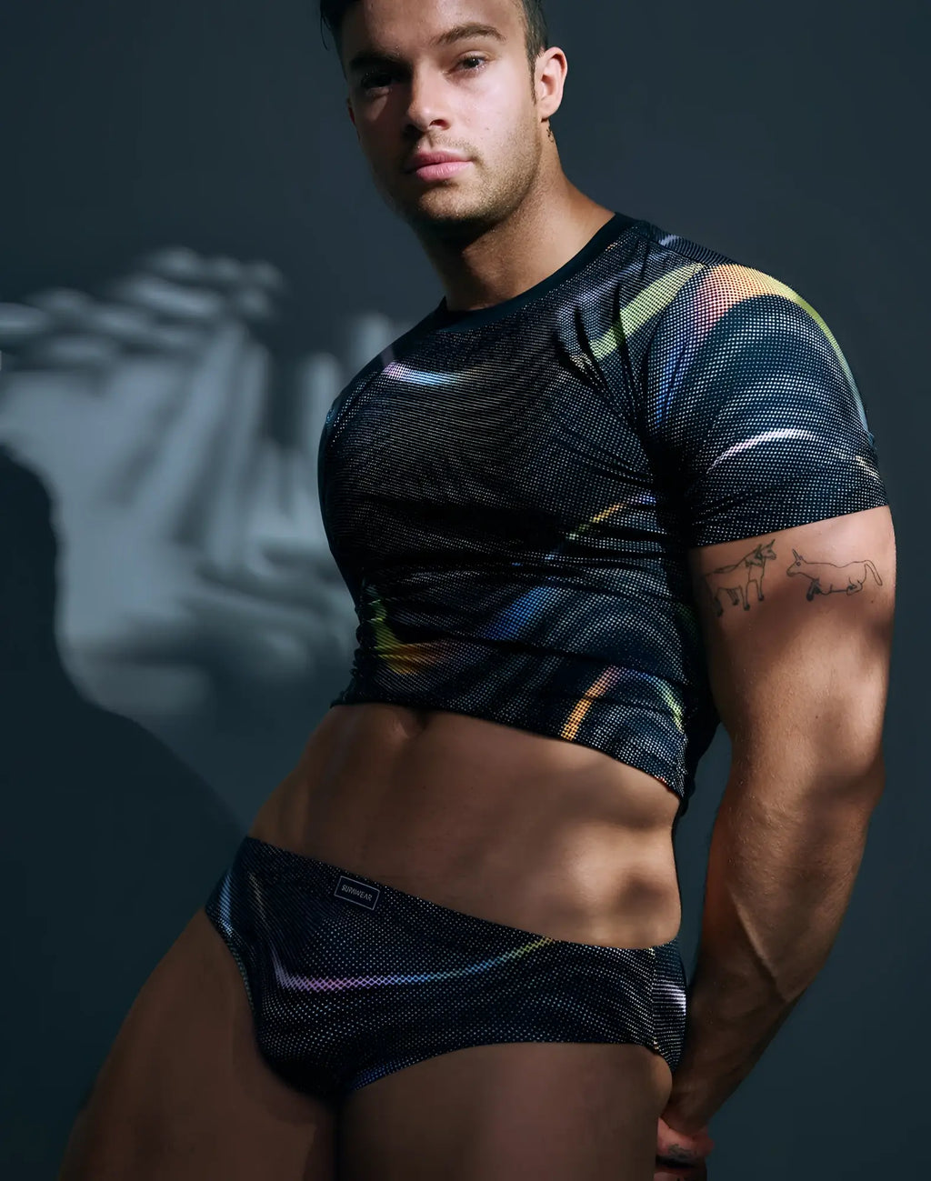 Black mesh crop top and briefs with iridescent rainbow stripes and subtle supawear logo printed pride underwear