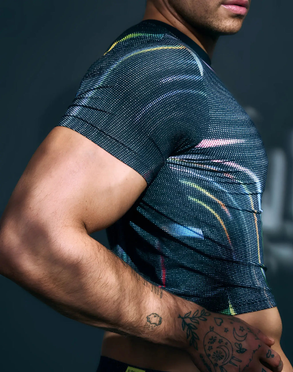 SupaweaR printed pride crop t-shirt black with subtle textured pattern and vibrant abstract rainbow streaks on chest