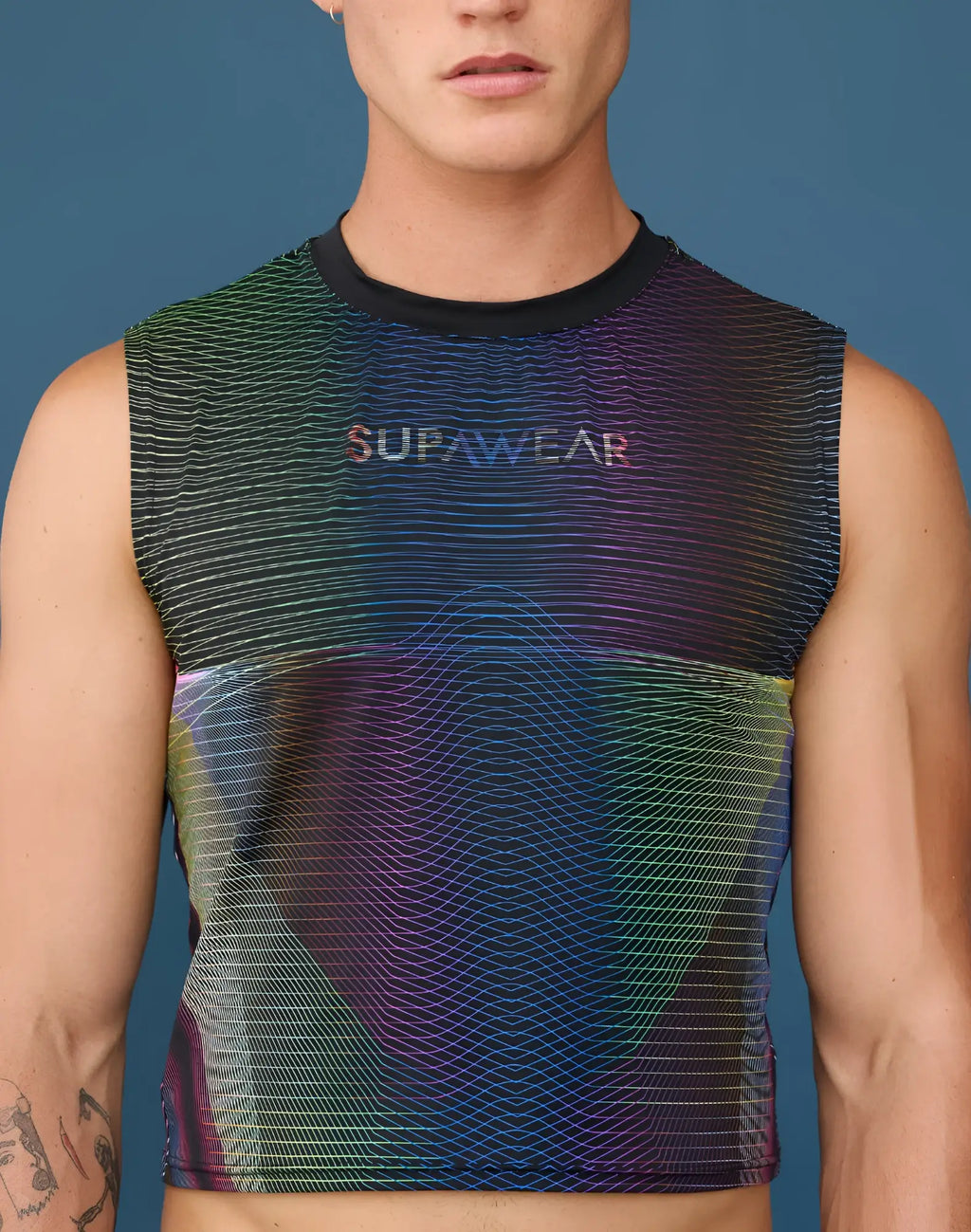 SupaWear printed pride crop tank in vibrant rainbow hues with iridescent wave pattern and black ribbed neckline