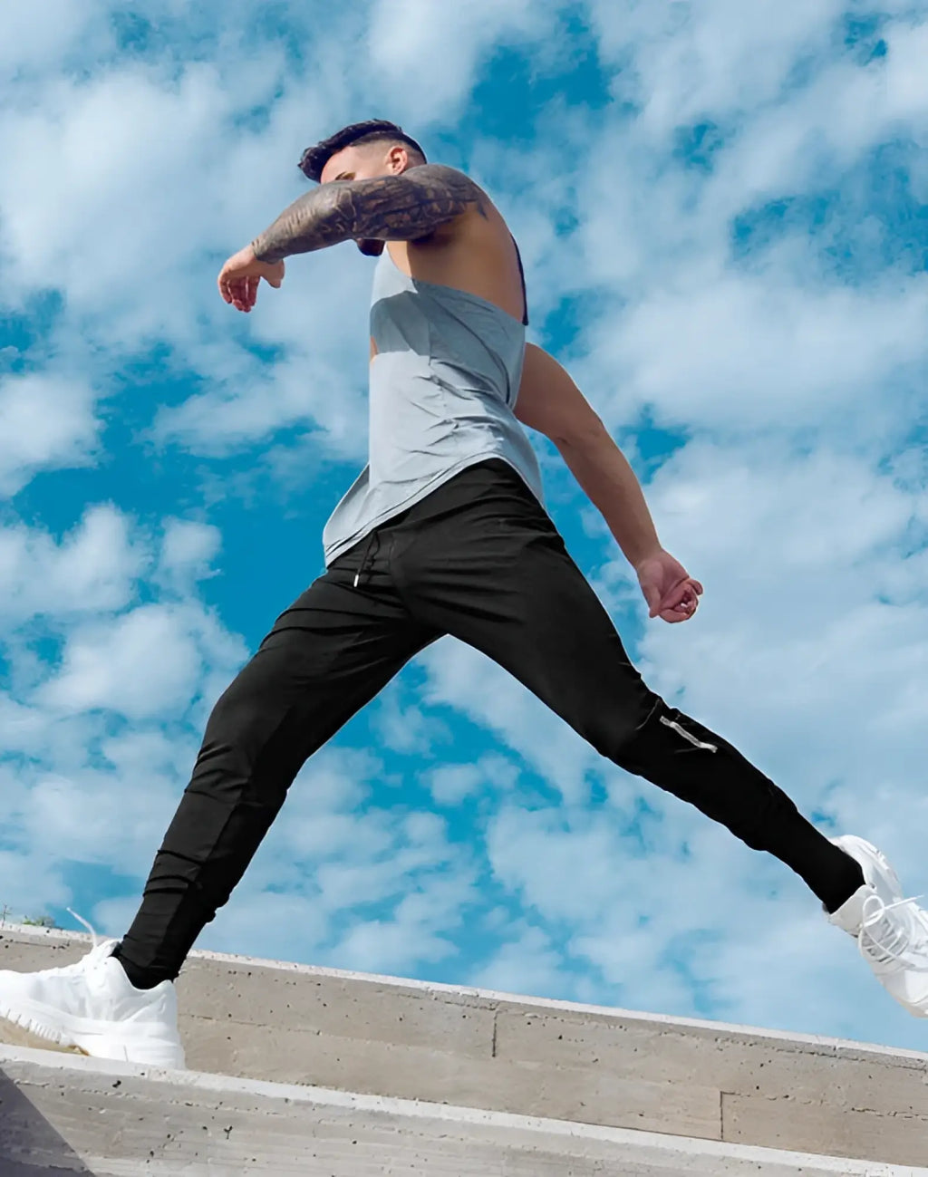 Black supawear pro-training athletic pants with white side stripes and drawstring waistband for active wear
