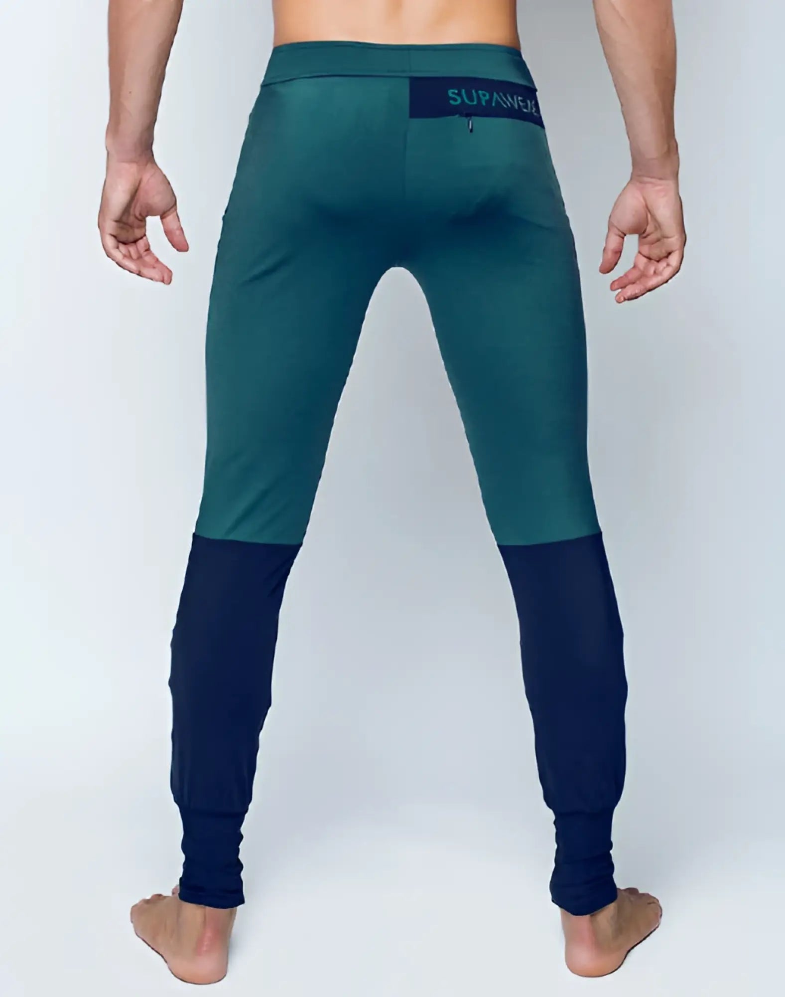 Dark green and navy blue two-tone supawear pro-training pants with branded waistband for athletic use