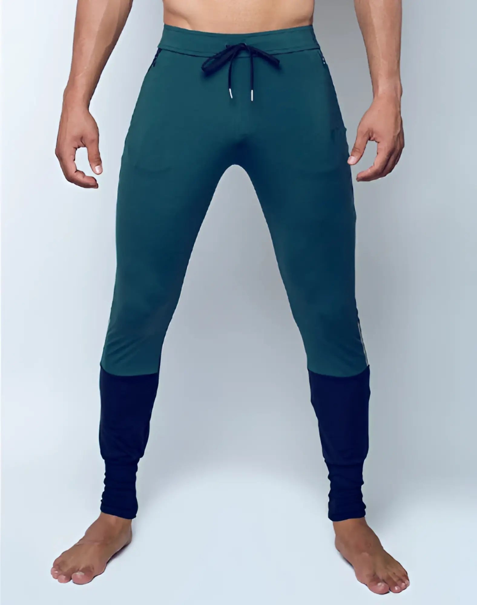 SupaWear pro-training pants in dark teal with navy blue cuff and drawstring waistband for athletic use