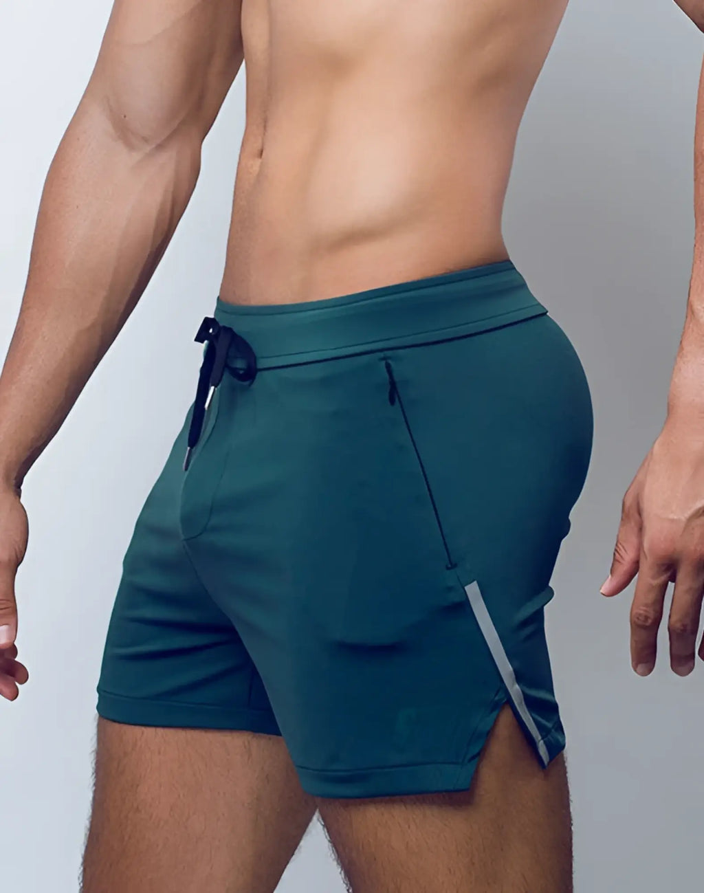 SupaWear Pro-Training shorts in boost green teal with drawstring waistband side pockets and gray reflective leg stripe